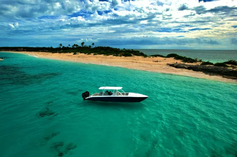 Offshore performance RIB anchored in Cyclades crystal-clear shallows